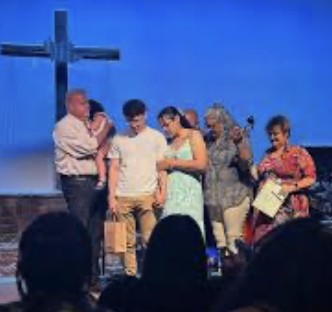 Praying together at the front of the sanctuary